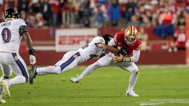 Dec 25, 2023; Santa Clara, California, USA; San Francisco 49ers quarterback Brock Purdy (13) is sacked by Baltimore Ravens cornerback Marlon Humphrey (44) during the first quarter at Levi's Stadium. Mandatory Credit: Neville E. Guard-USA TODAY Sports  